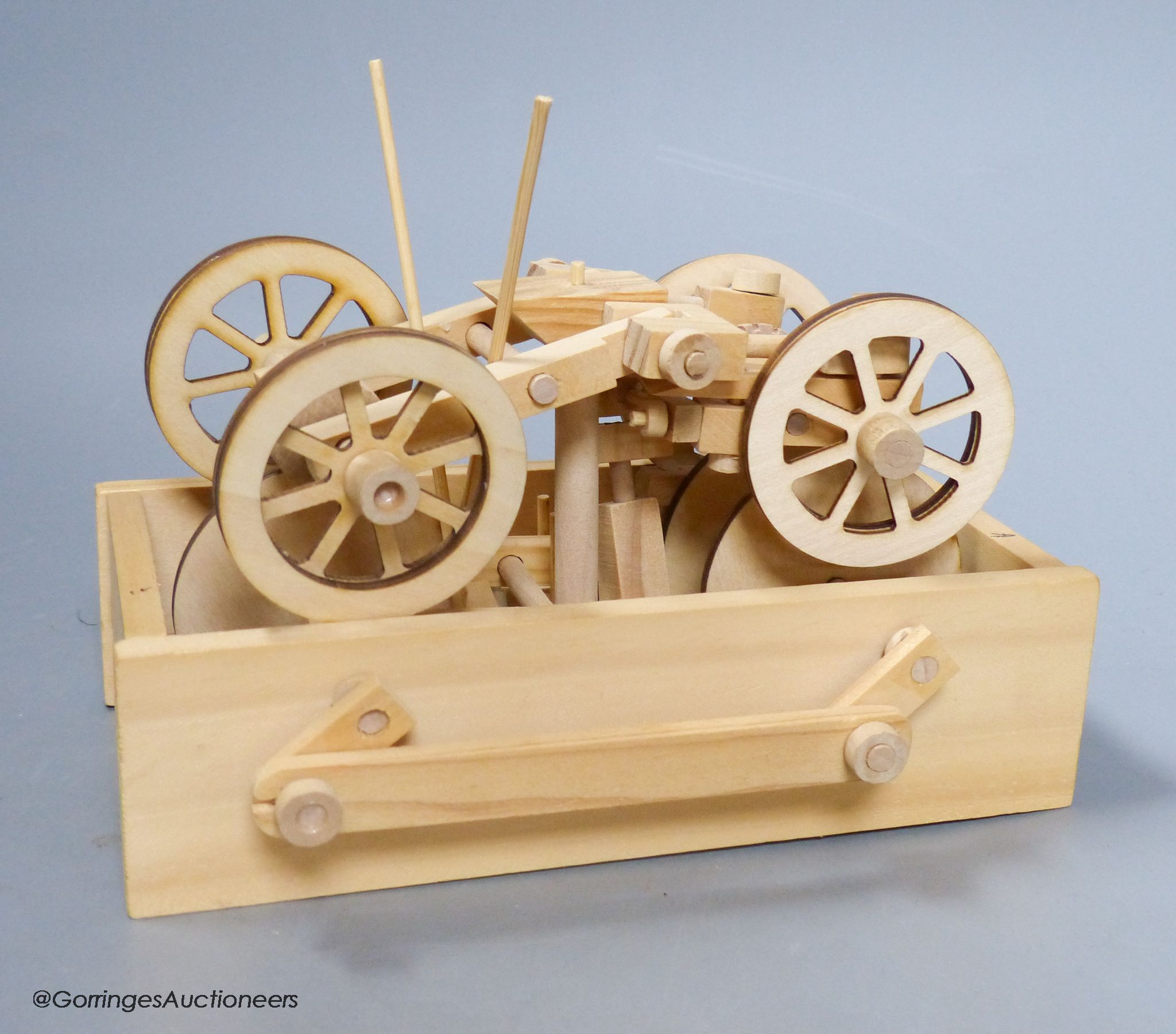 Two modern lightwood mechanical veteran motor cars, and a three masted battleship model